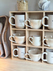 Wooden mug display shelf unit from Starlight Express, ideal for kitchen and dining room organization and decor.
