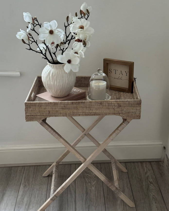 Lows rattan rectangle tripod side table with wooden legs, modern furniture piece for living room or patio decor.