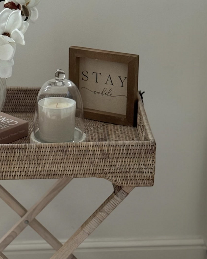 Lows rattan rectangle tripod side table with wooden legs and woven rattan surface, ideal for living room or bedroom decor.