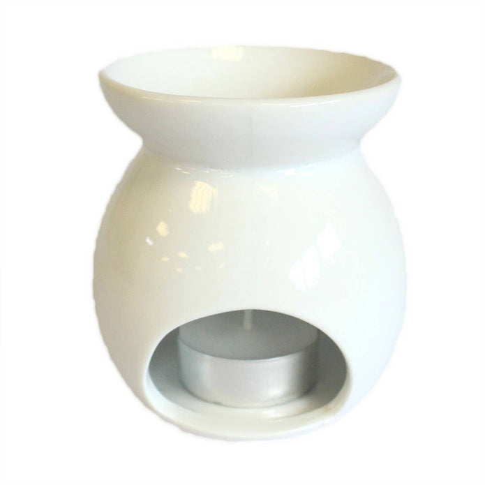 White small tree-shaped wax melt burner by Ancient Wisdom, with a shallow dish on top and a decorative tree design.