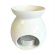 White small tree-shaped wax melt burner by Ancient Wisdom, with a shallow dish on top and a decorative tree design.