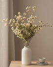 Artificial Daisy Flower Stem in cream by Starlight Express, featuring realistic cream-colored daisy blooms and green foliage.
