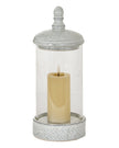 White ceramic hurricane candle lantern with intricate cutout design, perfect for home decor accents.