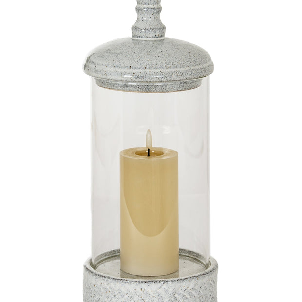 White ceramic hurricane candle lantern with intricate cutout design, perfect for home decor accents.
