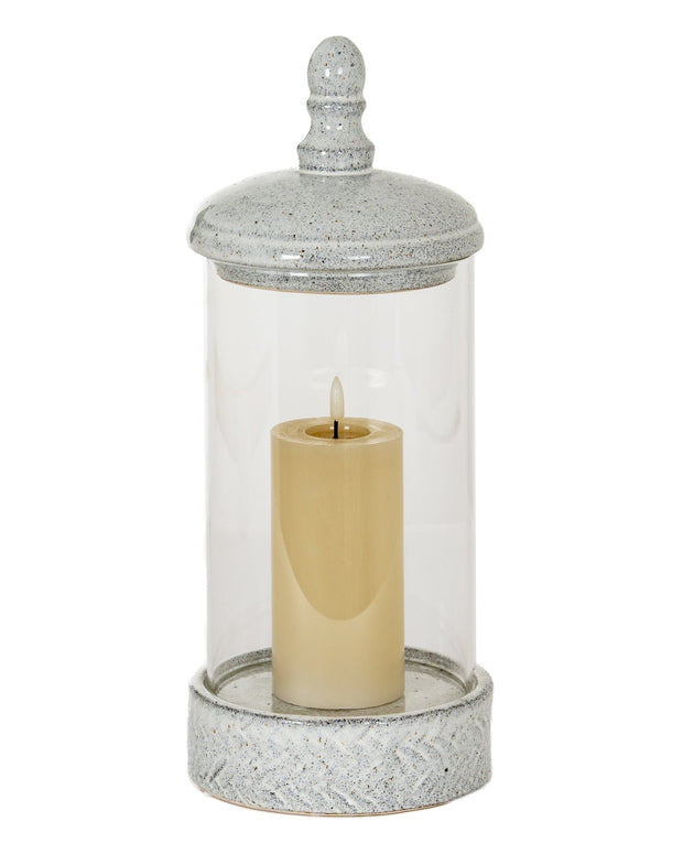 White ceramic hurricane candle lantern with intricate cutout design, perfect for home decor accents.