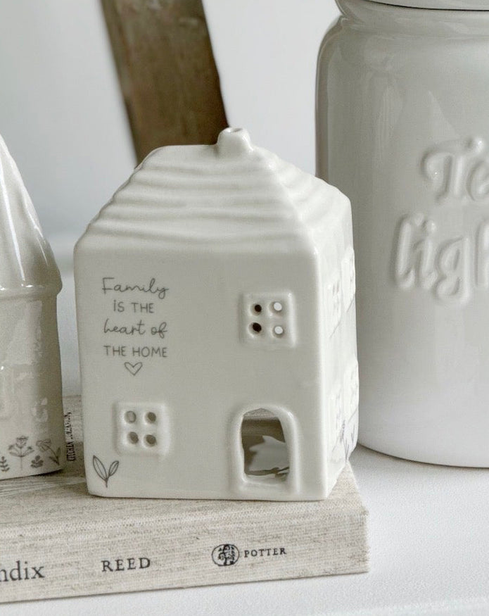 Beige ceramic house-shaped tea light holder from Widdop & Co’s Moments Family home décor collection.