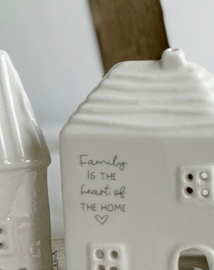 Beige ceramic house-shaped tea light holder with "Moments Family" design, ideal for home décor, by Widdop & Co.