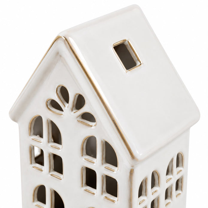 White ceramic LED light-up house decor by Sifcon, featuring a charming miniature house with glowing interior illumination.