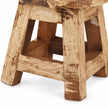 Close-up of the natural pine mini stool’s chunky legs and lower crossbars, showing wood texture and rustic surface marks.