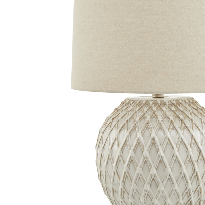 White lattice ceramic lamp by Hill Interiors, showcasing a stylish lighting fixture with intricate design and a smooth ceramic finish.