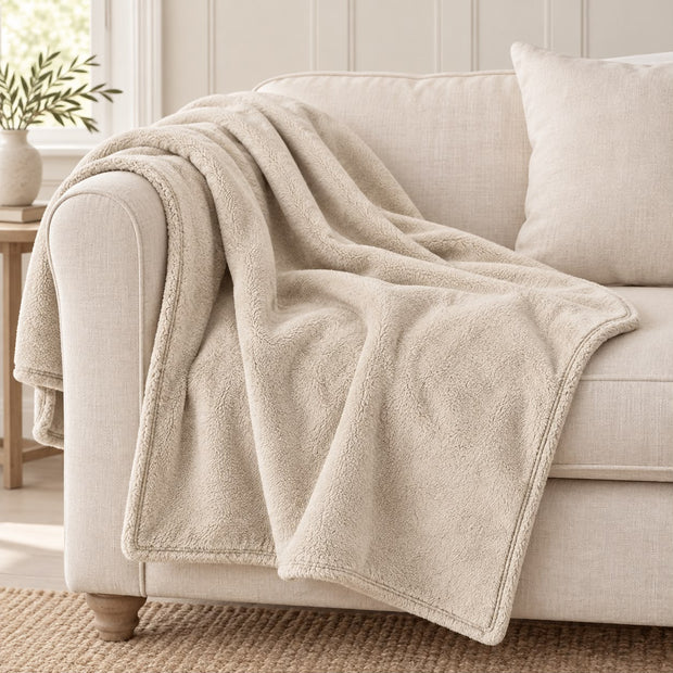 Cream Luxury Snuggle Blanket Throw, cream throw draped over a cream sofa