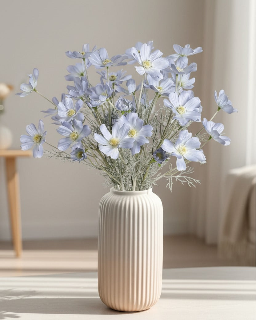 Artificial Ocean Blue Cosmos flower stem from Starlight Express, showcasing vibrant blue petals and green foliage for decorative use.