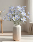 Artificial Ocean Blue Cosmos flower stem from Starlight Express, showcasing vibrant blue petals and green foliage for decorative use.