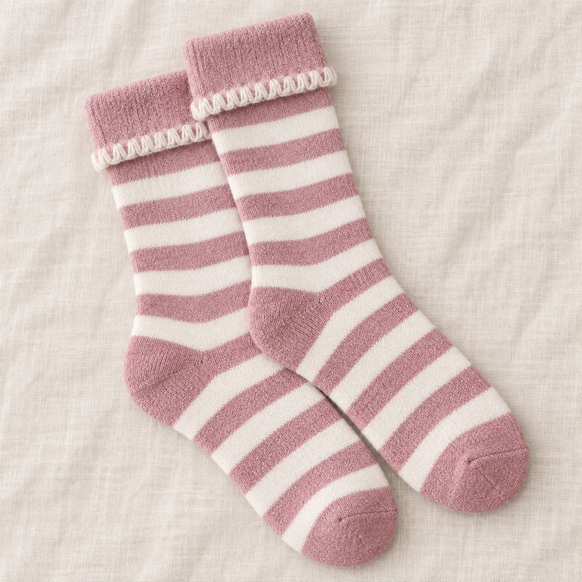 Super Cosy Fluffy Cuff Socks - Pink Stripe, pink striped socks with cream-trimmed cuffs on pale fabric