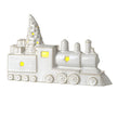 White Ceramic Light-Up LED Train, white ceramic train with star cutouts and glowing windows on white