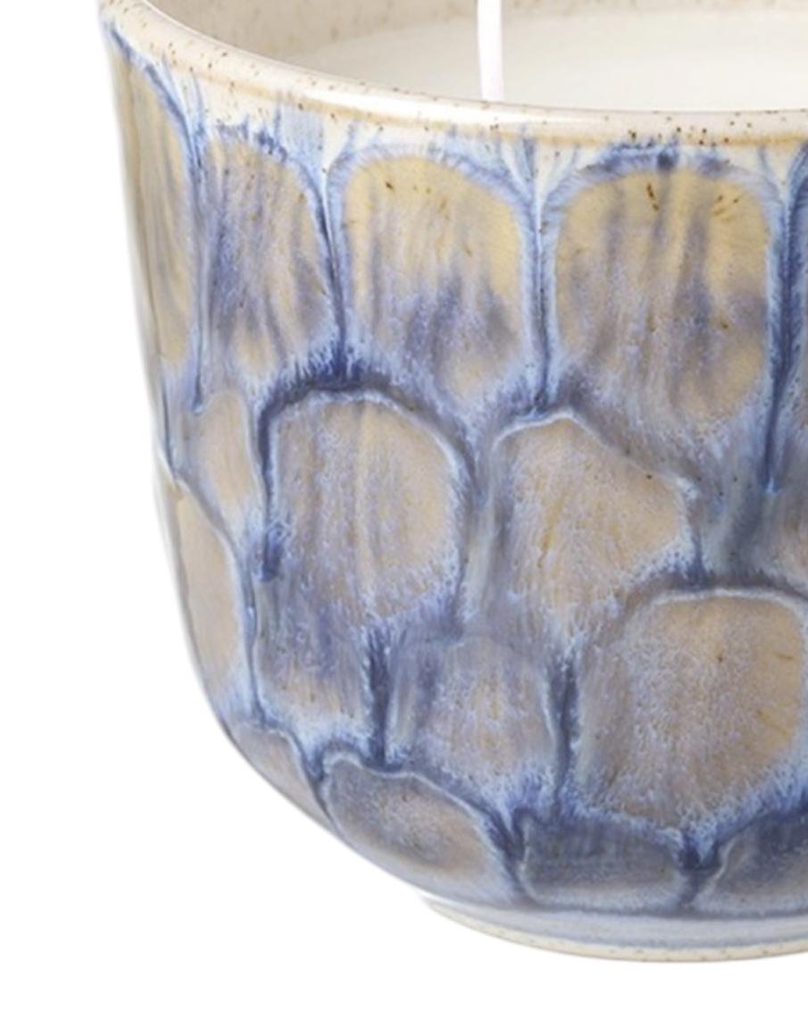 Navy blue two-wick ceramic candle by Heaven Sends, featuring a smooth, round design and a wick for a cozy ambiance.