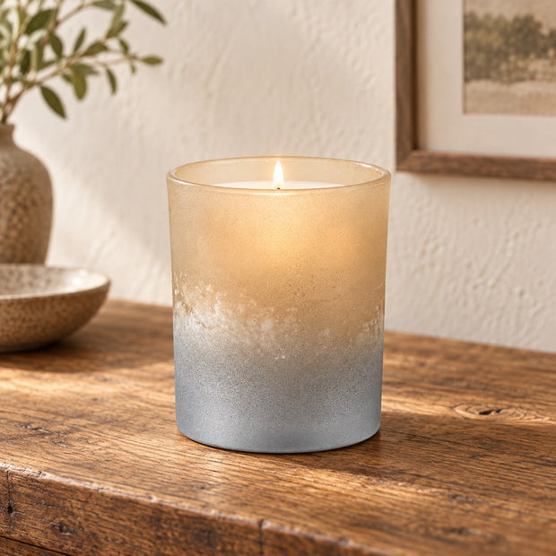 Faded Bronze Glass Tealight Holder, glowing bronze and silver glass holder beside framed artwork