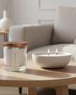 White scented candle in a sand jar labeled Rhubarb Sparkle from The Candledust home fragrance collection.