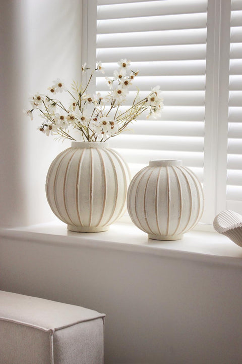Striped decorative vase from Hill Interiors, ideal for home décor, featuring a globe-inspired design in neutral tones.
