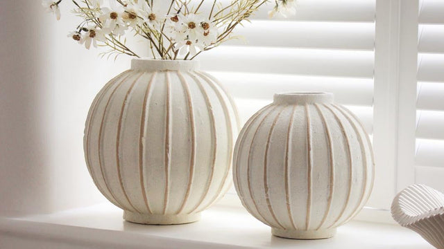 Globe striped decorative vase for home décor from Hill Interiors, featuring a round shape with blue and white striped pattern.