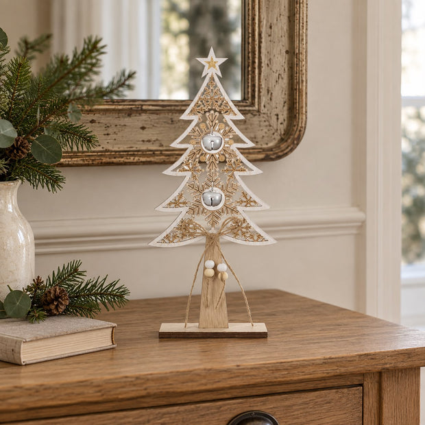 Wooden Tree With White Bells, wooden tree with hanging bells beside a mirror