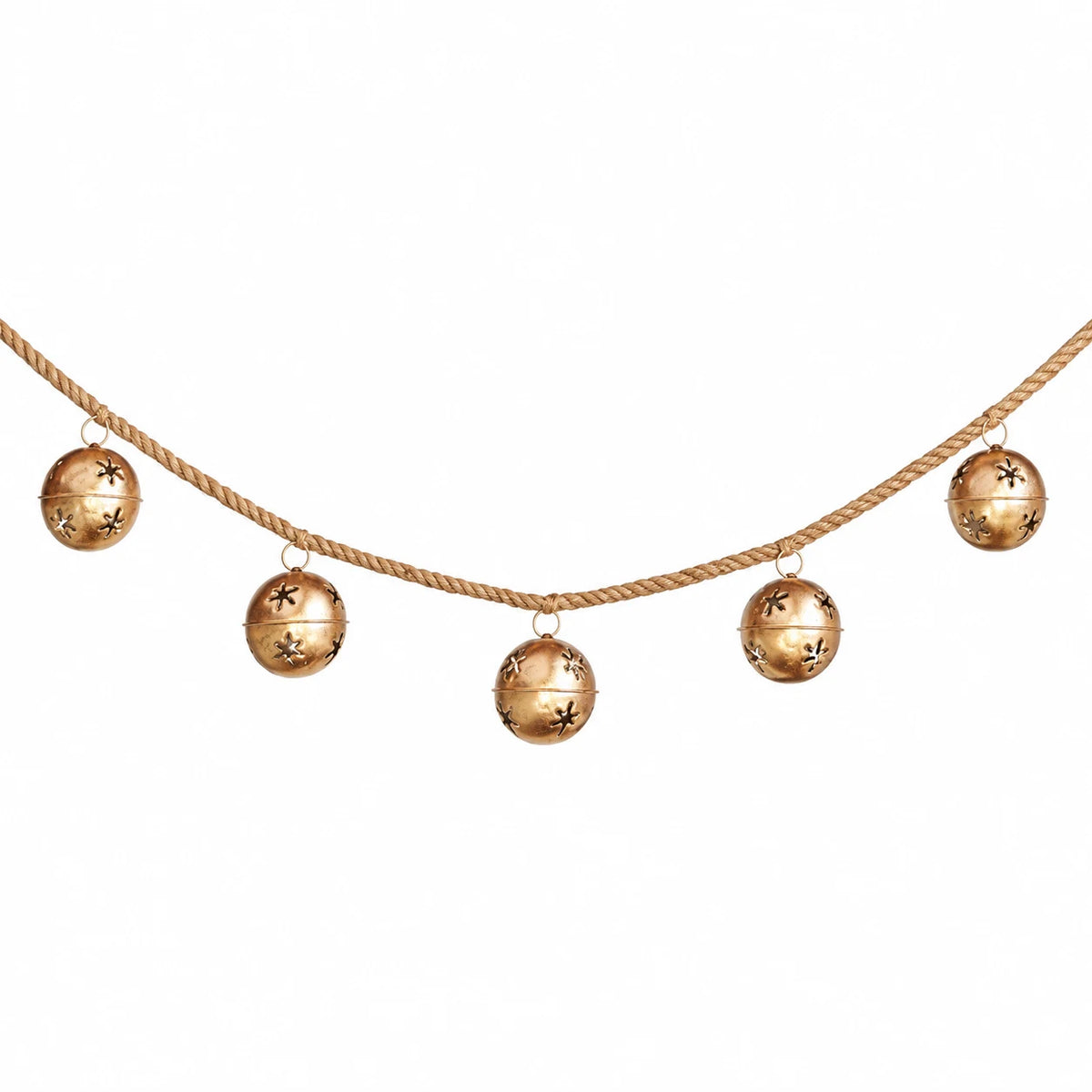 Section of the sleigh bell garland with gold bells and natural cord against white.