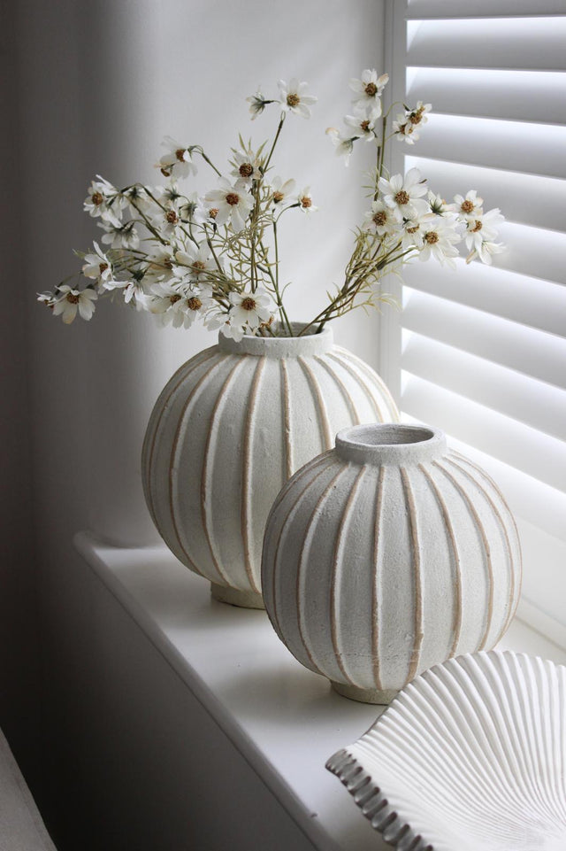 Decorative vase with globe striped pattern, Hill Interiors home décor piece, ceramic with blue and white design, suitable for display.