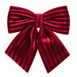 Small burgundy luxury velvet bow on a white studio background.