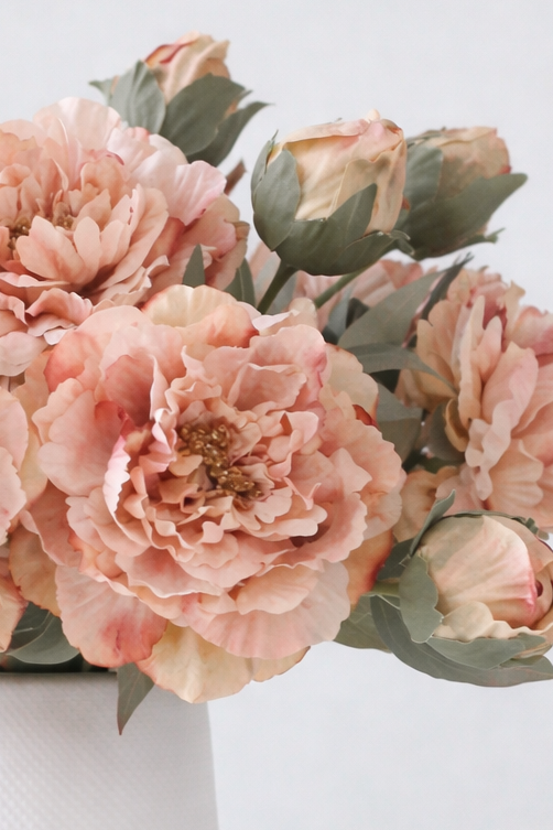 Artificial peach open double peony flower stem by Starlight Express, showing realistic peach-colored petals and green stem.