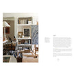 Open interior design coffee table book titled The Essentials: The Art of Interior Design by Abrams & Chronicle Books, showing colorful pages.