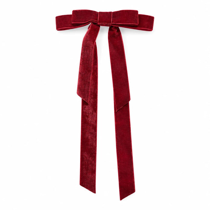 Single burgundy long-tail velvet bow from the eight-piece set against white.