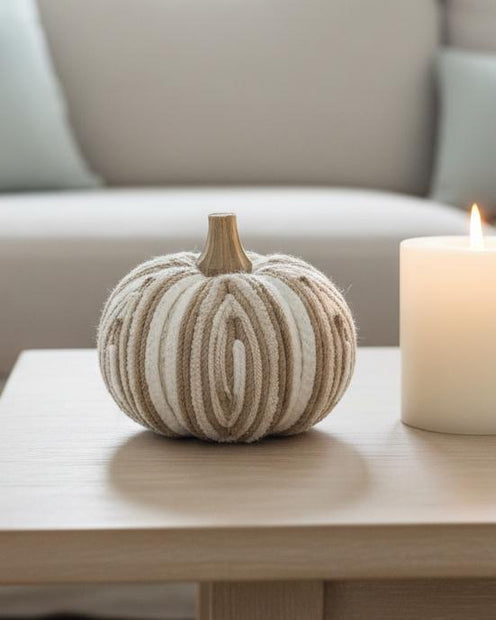 Beige Cream Fabric Stripe Pumpkin – Elegant Neutral Autumn Decoration, beige and cream striped fabric pumpkin beside a candle