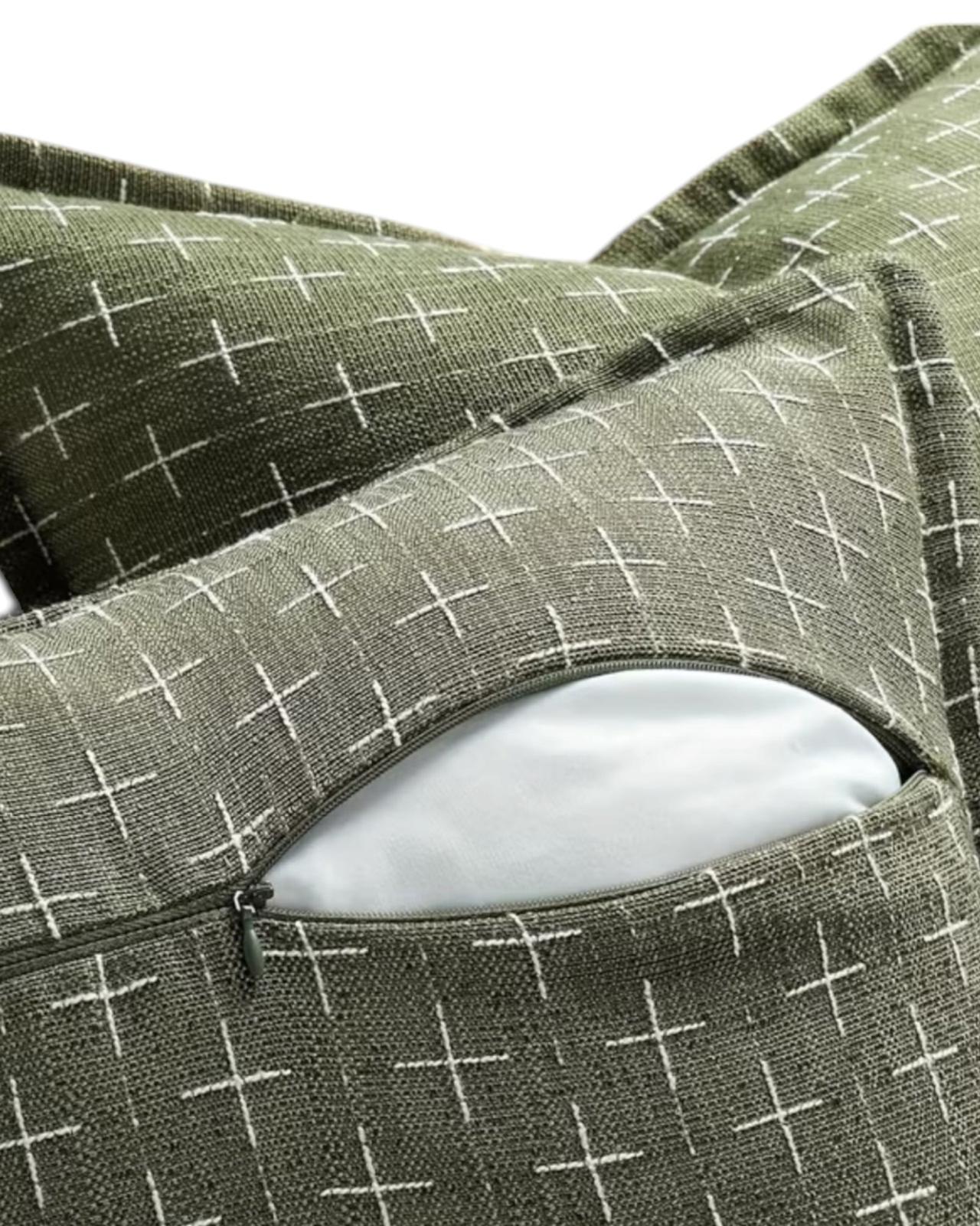 Olive green woven cushion cover with cross design from Starlight Express, made of soft furnishings fabric, decorative home accent.