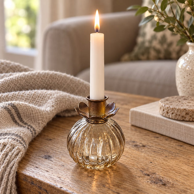 Rustic Flower Bottle Candle Holder Insert, brass-coloured flower insert in a ribbed glass bottle with a lit candle