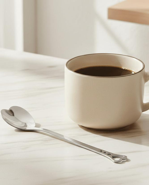Silver heart handle spoon from Starlight Express, stylish kitchen and dining utensil with a decorative heart-shaped handle.