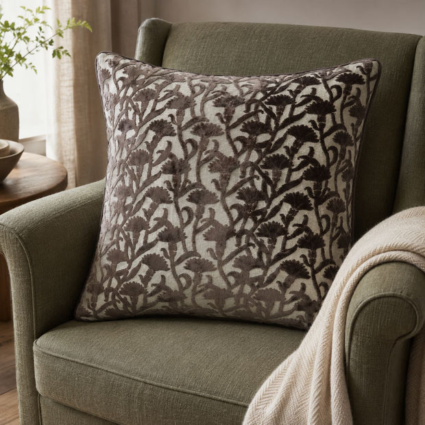 Chocolate Brown Velvet Floral Print Cushion Cover, chocolate brown floral cushion beside a throw on a green armchair