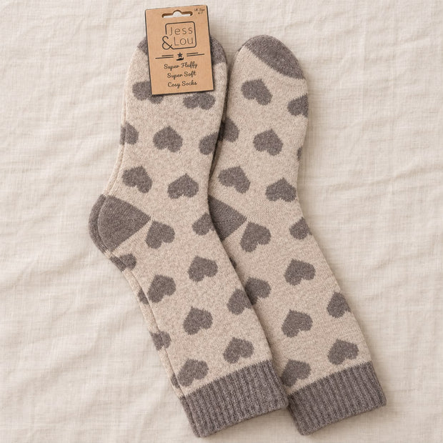 Cappuccino Heart Cosy Socks, beige socks with grey hearts arranged on linen