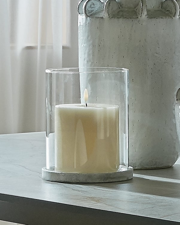 Natural stone hurricane candle lantern for home decor by Hill Interiors, featuring a clear glass enclosure and rustic design.