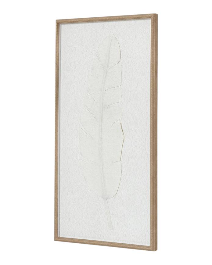 Large white feather print wall art in a frame, designed by Hill Interiors, displayed on a neutral wall.