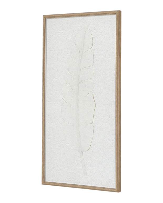 Large white feather print wall art in a frame, designed by Hill Interiors, displayed on a neutral wall.