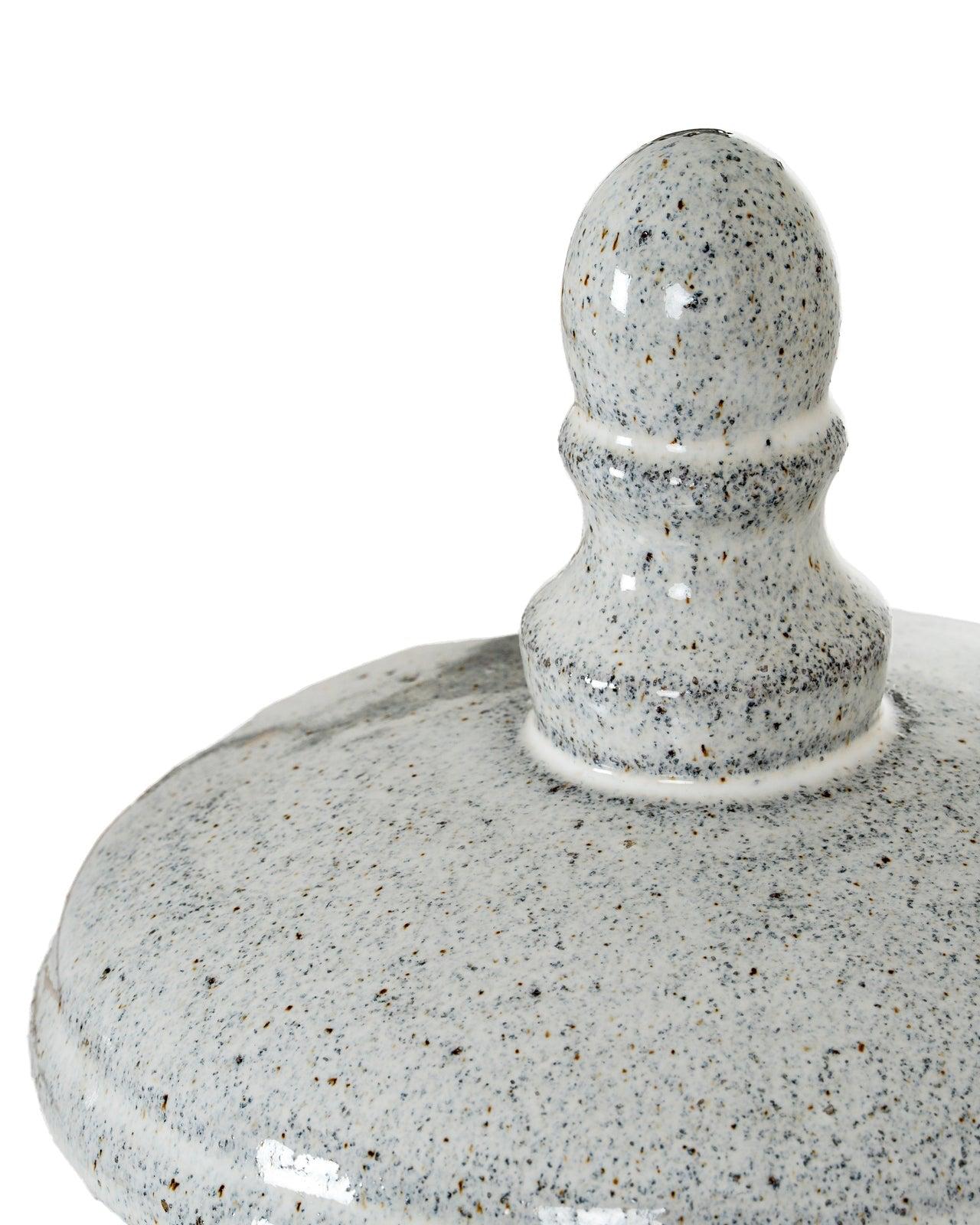 White ceramic hurricane candle lantern for home decor, featuring a classic design with a glass insert for candles.