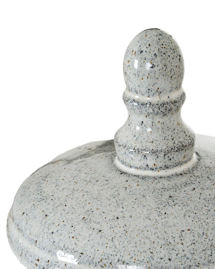 White ceramic hurricane candle lantern for home decor, featuring a classic design with a glass insert for candles.