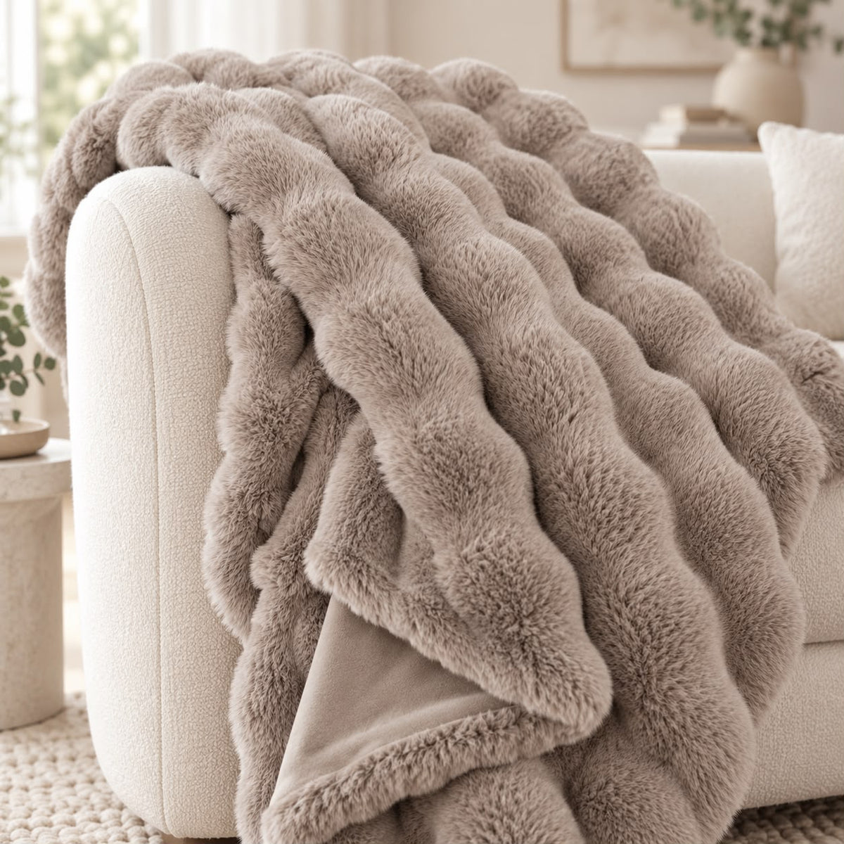 Beige Luxury Faux Fur Blanket Throw, close-up of the beige faux fur throw on a sofa arm
