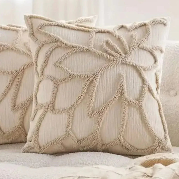 Beige flower embroidered boucle cushion cover by Starlight Express, soft furnishings, with floral embroidery and textured boucle fabric.