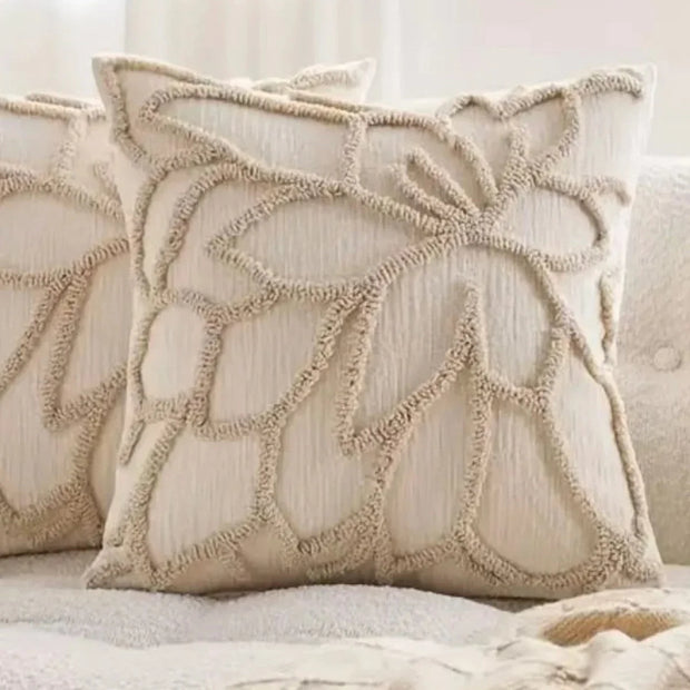 Beige flower embroidered boucle cushion cover by Starlight Express, soft furnishings, with floral embroidery and textured boucle fabric.