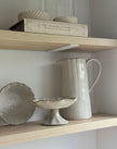 Beige stoneware pinched footed bowl by Gisela Graham, ideal for kitchen and dining use, with a textured, handcrafted appearance.