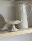 Beige stoneware pinched footed bowl by Gisela Graham for kitchen and dining, with a textured, handmade appearance.