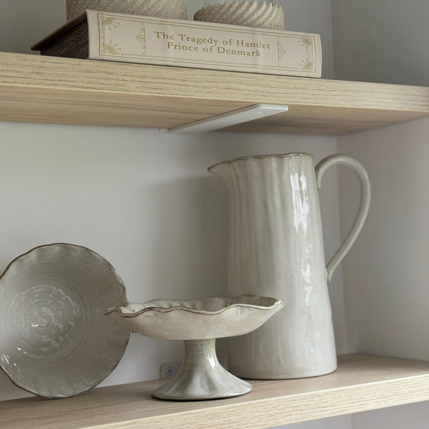 Beige stoneware pinched footed bowl by Gisela Graham, ideal for kitchen and dining use, with a textured, handcrafted appearance.