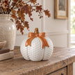White ceramic pumpkin with orange bow, decorative autumn ornament from Heaven Sends, featuring a smooth finish and festive design.