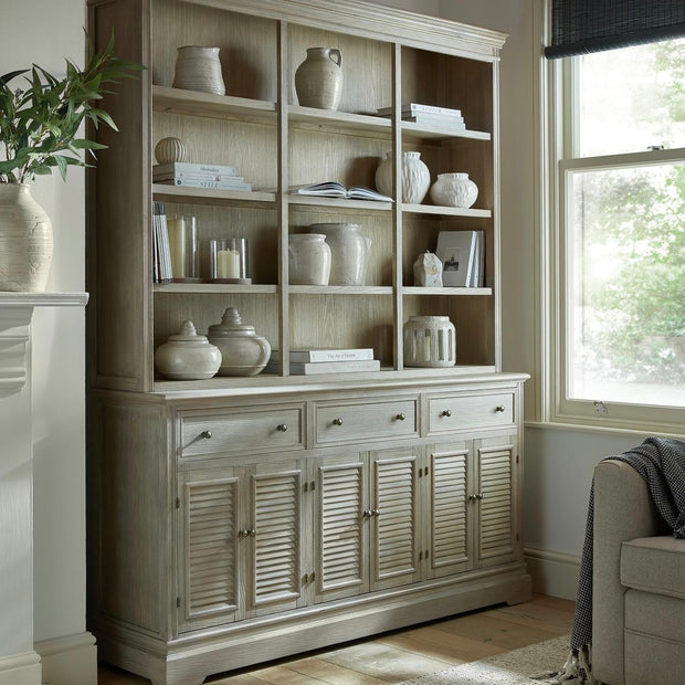 Large Delphine Collection dresser base with six doors and three drawers from Hill Interiors, showcasing a modern furniture design.